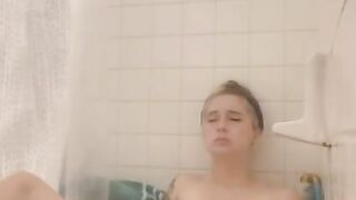 Sexy Petite and Tatted Babe Plays with Toy in Tub