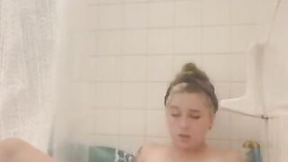 Sexy Petite and Tatted Babe Plays with Toy in Tub