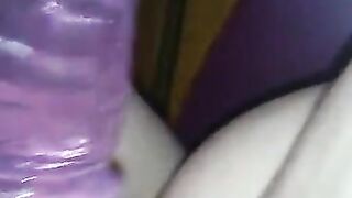 Riding purple dildo