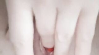 Red nails finger in petite, natural, pink Eastern European pussy.