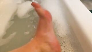 Exfoliating my feet in the tub