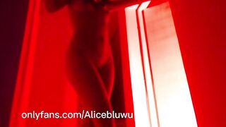 Sexy body of a Latina brunette in red light