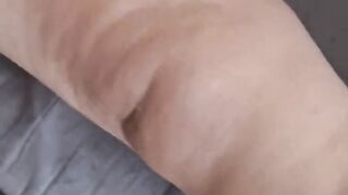 Fat mature grandmother takes off her pantyhose. She shows her hairy pussy and shakes her fat breasts.