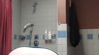 Slut spreads her holes in the bathroom