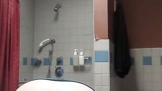 Slut spreads her holes in the bathroom