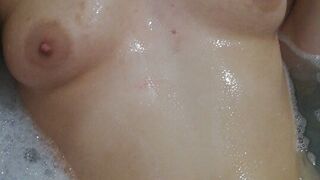 Sexy submissive teen playing with soapy boobs