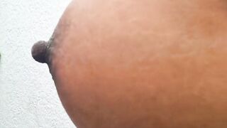 Ebony milf strips completely naked on the patio and shows her hairy pussy while peeing