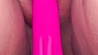 Red nails holding pussy with a vibration for orgasm