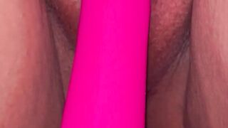 Red nails holding pussy with a vibration for orgasm