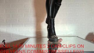 Mistress elle presents her spiked boots to her slave