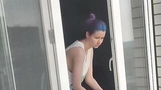 A neighbor girl washes windows without a bra and panties