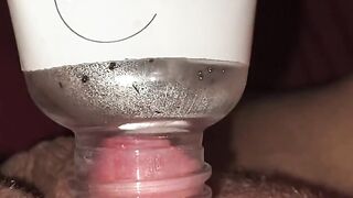 Horny and desperate girl uses a bottle to suck clit