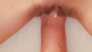 Fisting a teen's shaved pussy close up