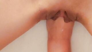 Fisting a teen's shaved pussy close up